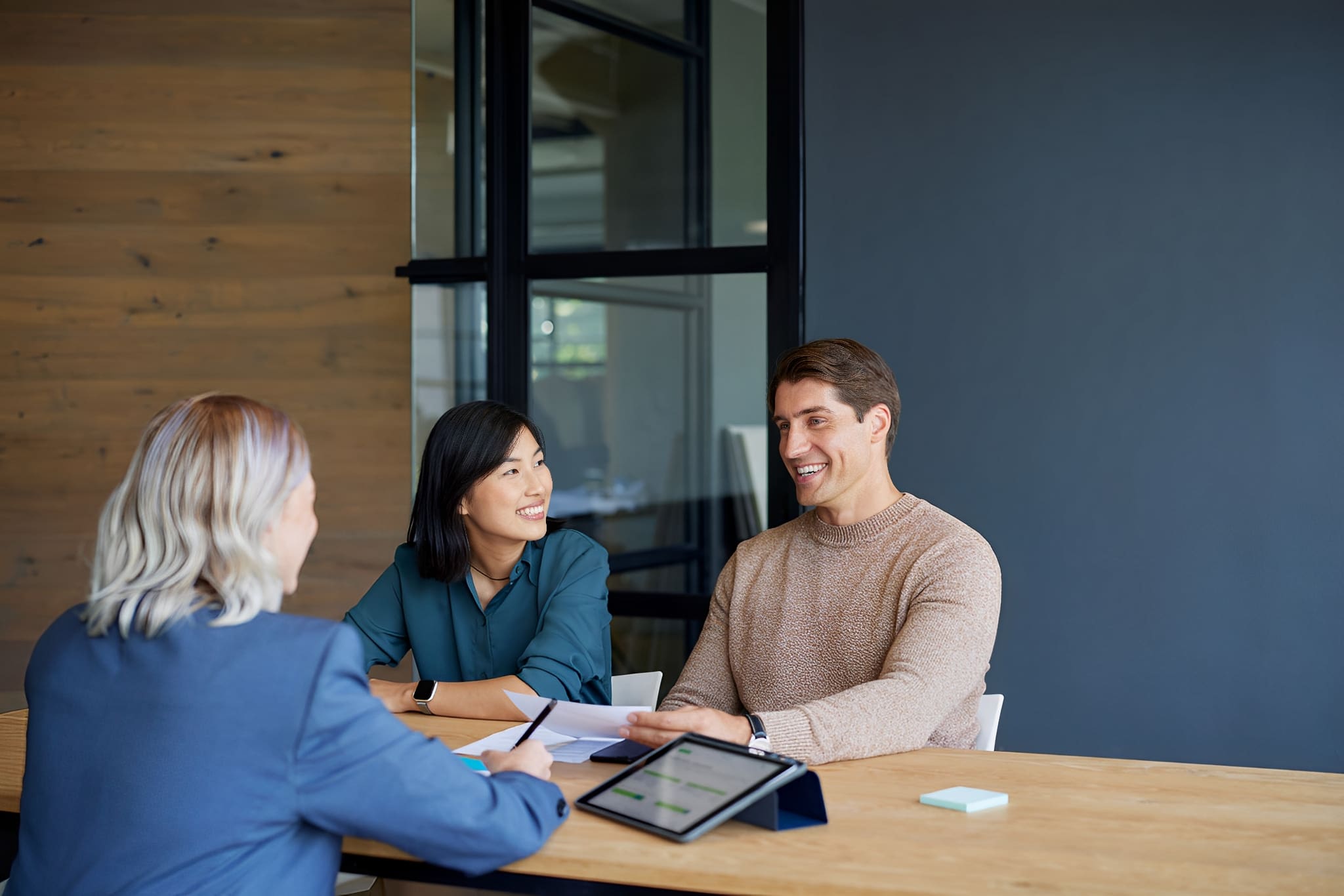 Three people having a business meeting.