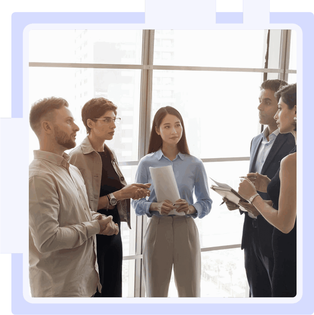 Group discussing in a modern office setting.